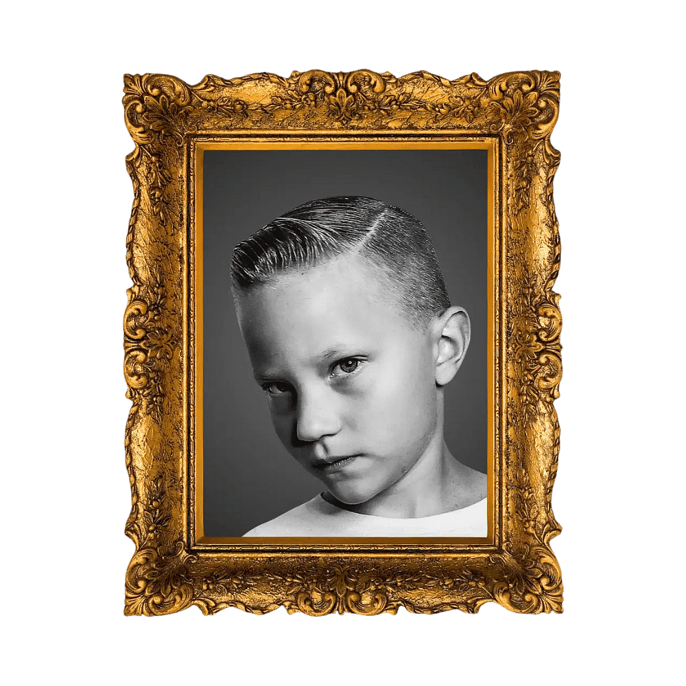 Black and white portrait of a serious boy in a golden ornate frame on a green background.