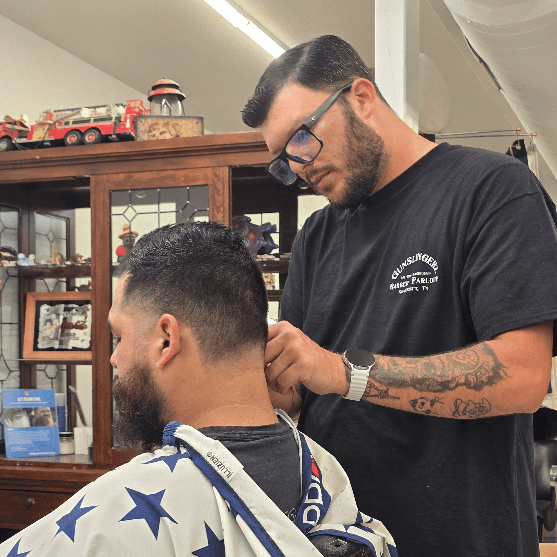 Portrait of Xavier, a professional stylist at Gunslingerz: An Old-Fashioned Barber Parlour, showcasing their expertise and style.